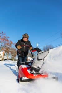 Man pushing Snow Blower